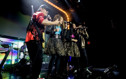 Band performing on stage during The Jets: Back to the 80's & 90's Experience.