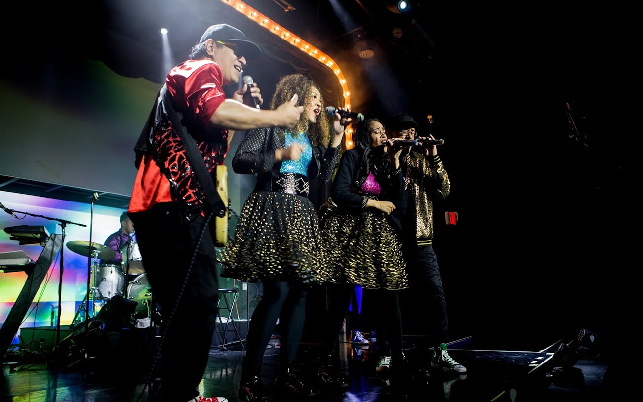 Band performing on stage during The Jets: Back to the 80's & 90's Experience.