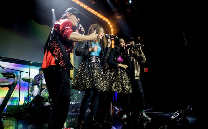 Band performing on stage during The Jets: Back to the 80's & 90's Experience.