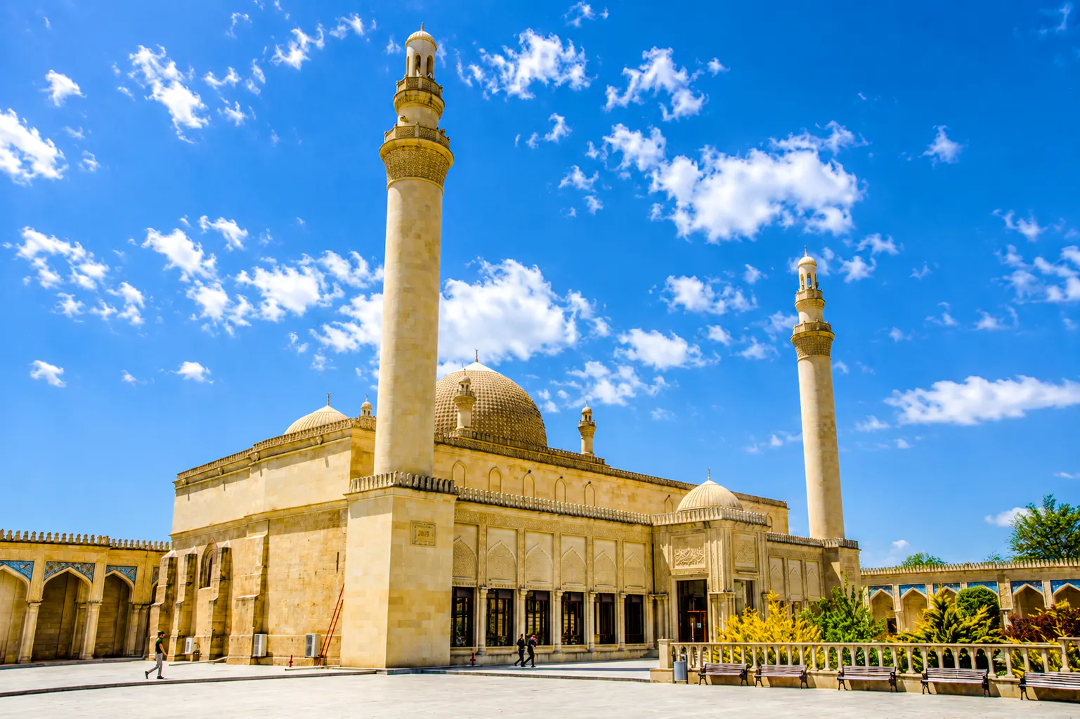 Khan's Palace in Sheki with minarets under a blue sky, part of Baku full-day tour.