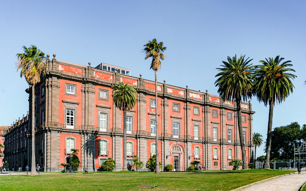 Capodimonte Museum exterior with palm trees, Naples, Italy.