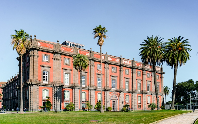 Capodimonte Museum exterior with palm trees, Naples, Italy.
