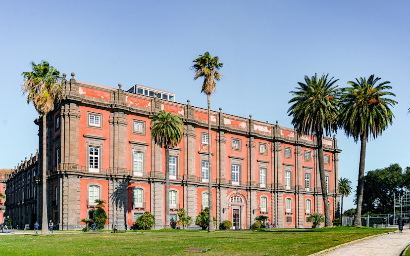 Capodimonte Museum exterior with palm trees, Naples, Italy.