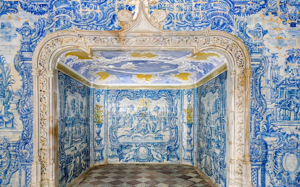 Portuguese ceramic tiles in National Sintra Palace showcasing intricate blue designs.