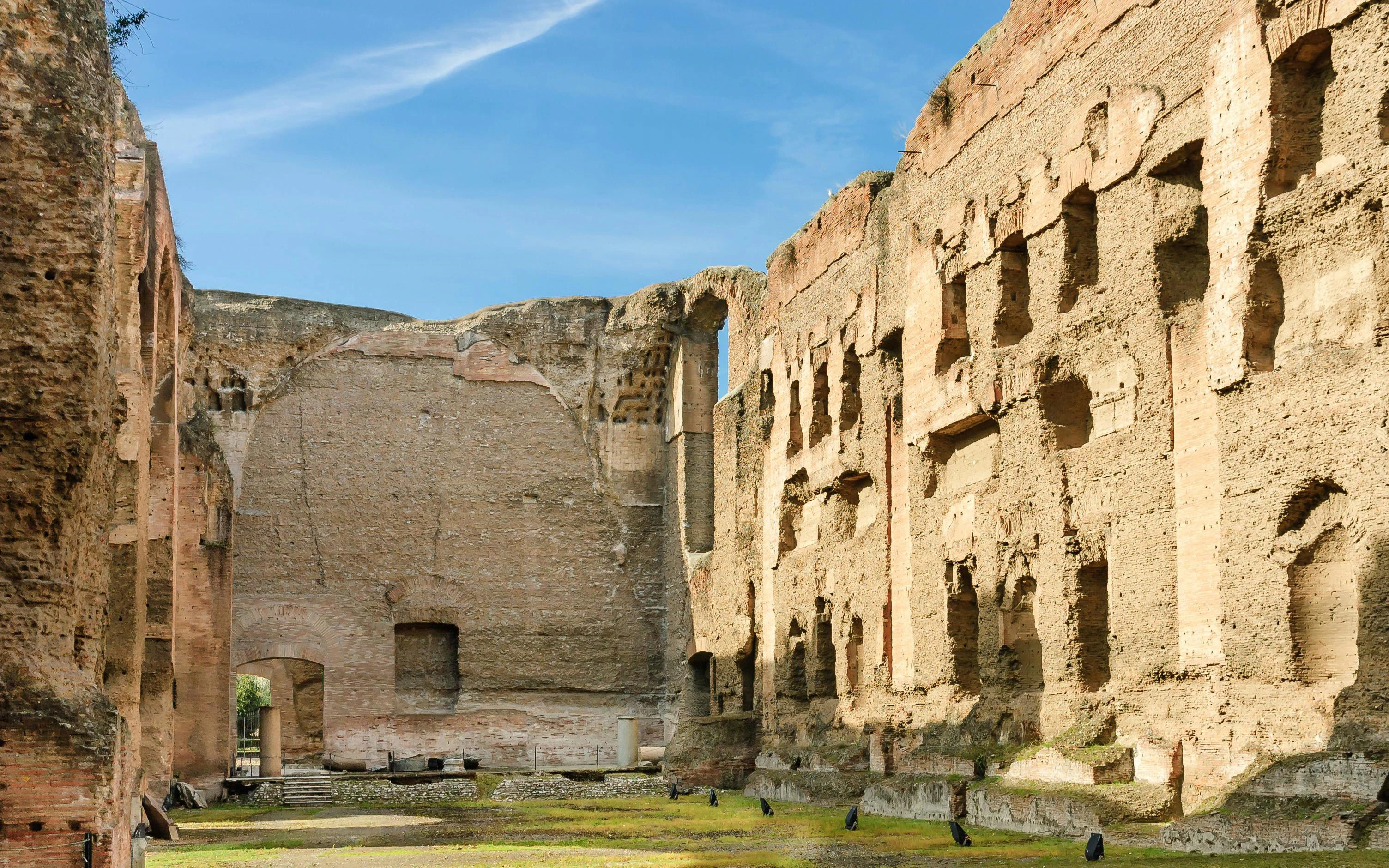 Ruins of the Baths of Caracalla in Rome, showcasing ancient Roman architecture.