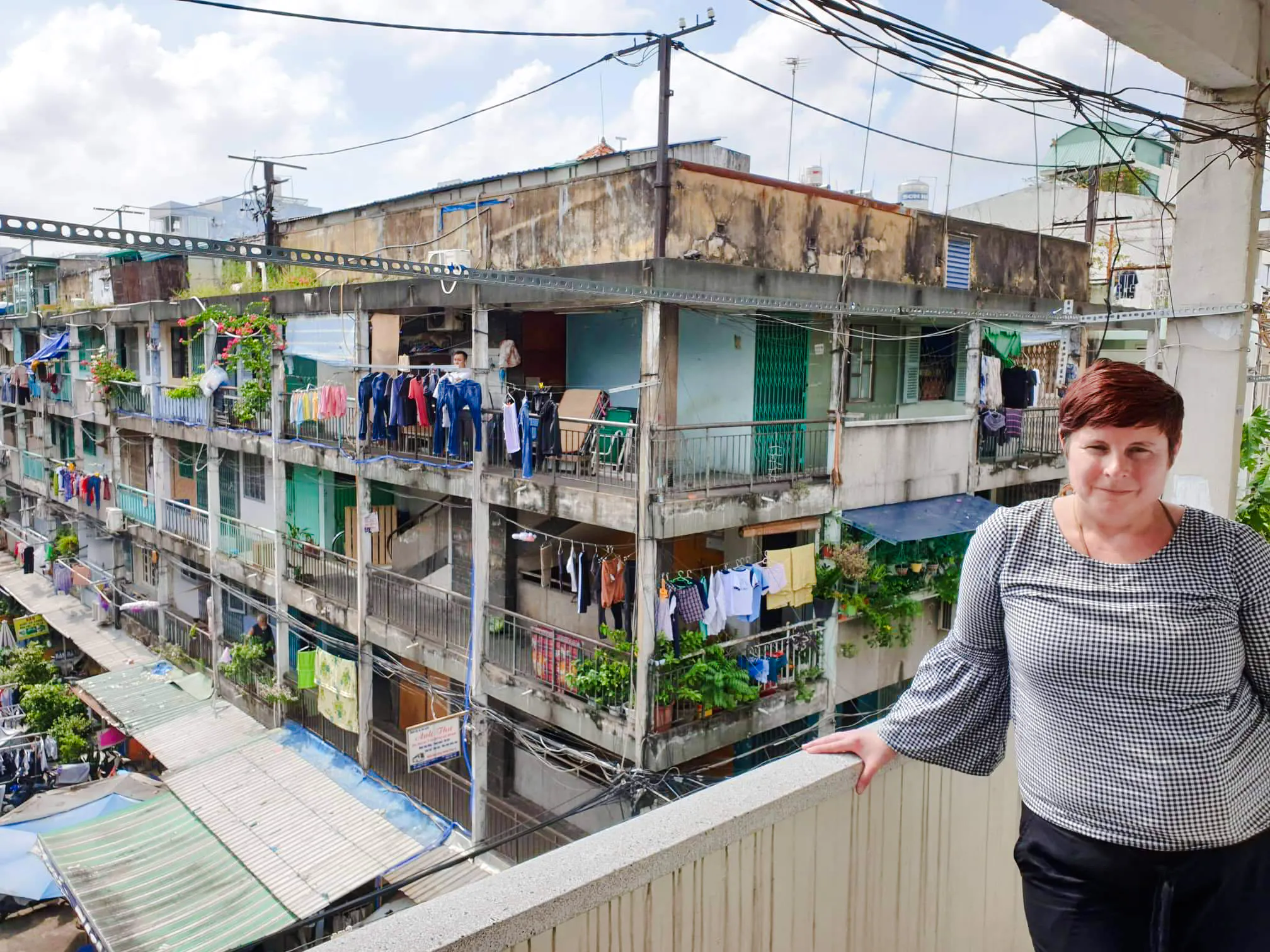 Balcony view of local apartments with laundry hanging, Saigon Hidden Gems Day Tour, Ho Chi Minh City.