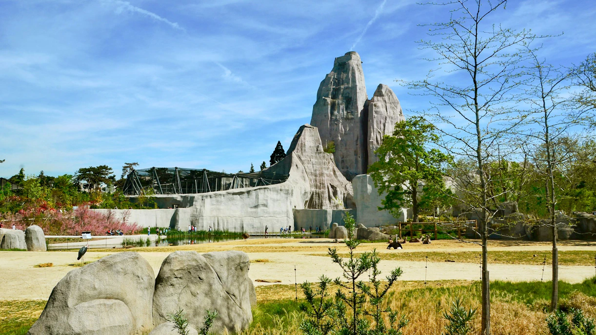 Zoo De Vincennes landscape with rock formations and greenery.
