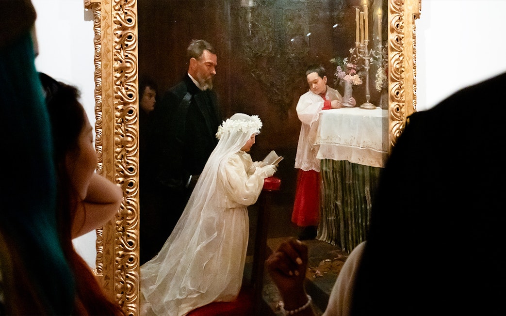 Visitors viewing a painting at the Picasso Museum during a skip-the-line guided tour.