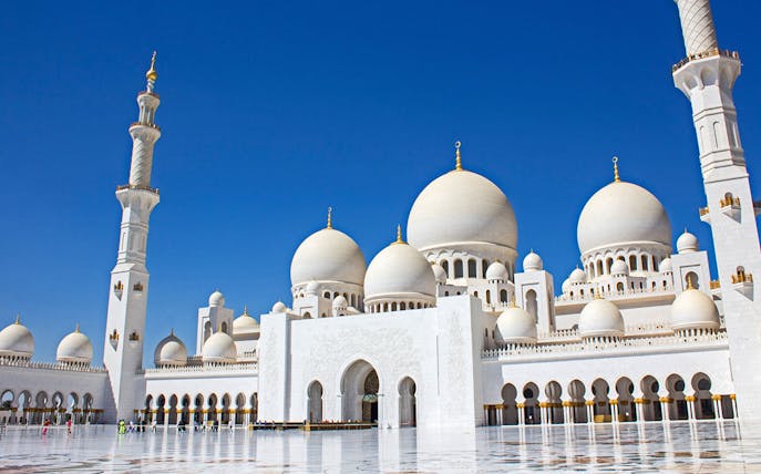 Sheikh Zayed Grand Mosque in Abu Dhabi with blue sky background.