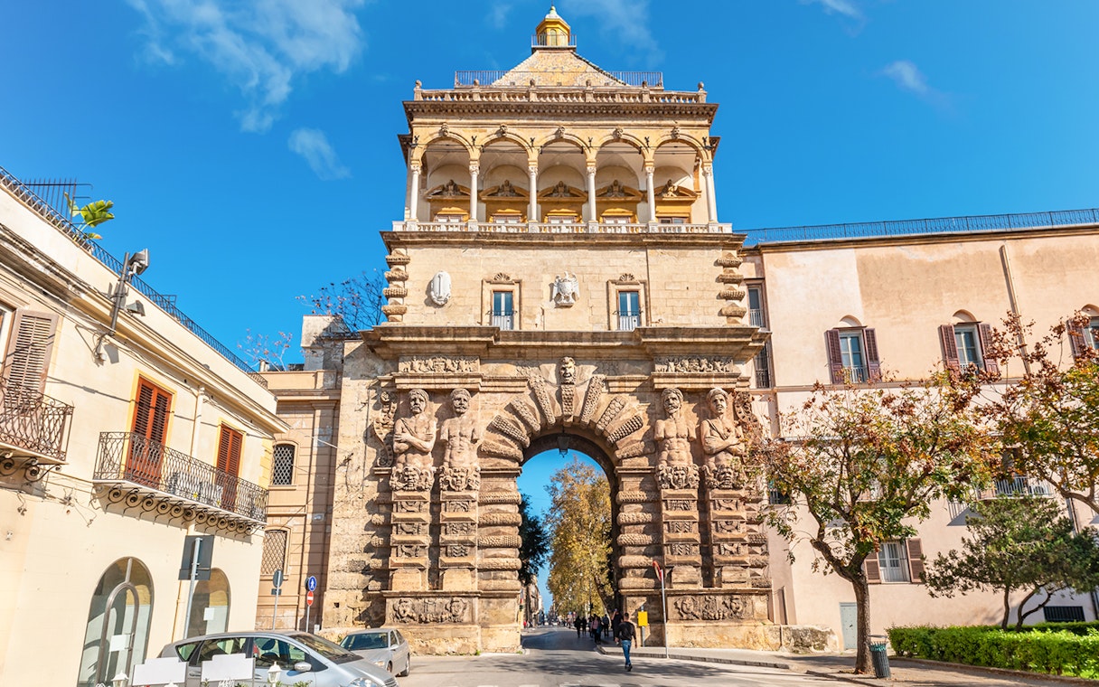 Porta Nuova in Palermo, Italy, showcasing its ornate stone arch and sculptures.