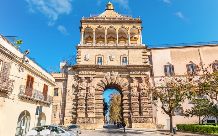 Porta Nuova in Palermo, Italy, showcasing its ornate stone arch and sculptures.