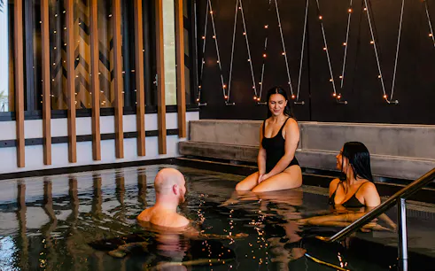 Visitors relaxing in a pool at Wai Ariki Hot Springs & Spa.
