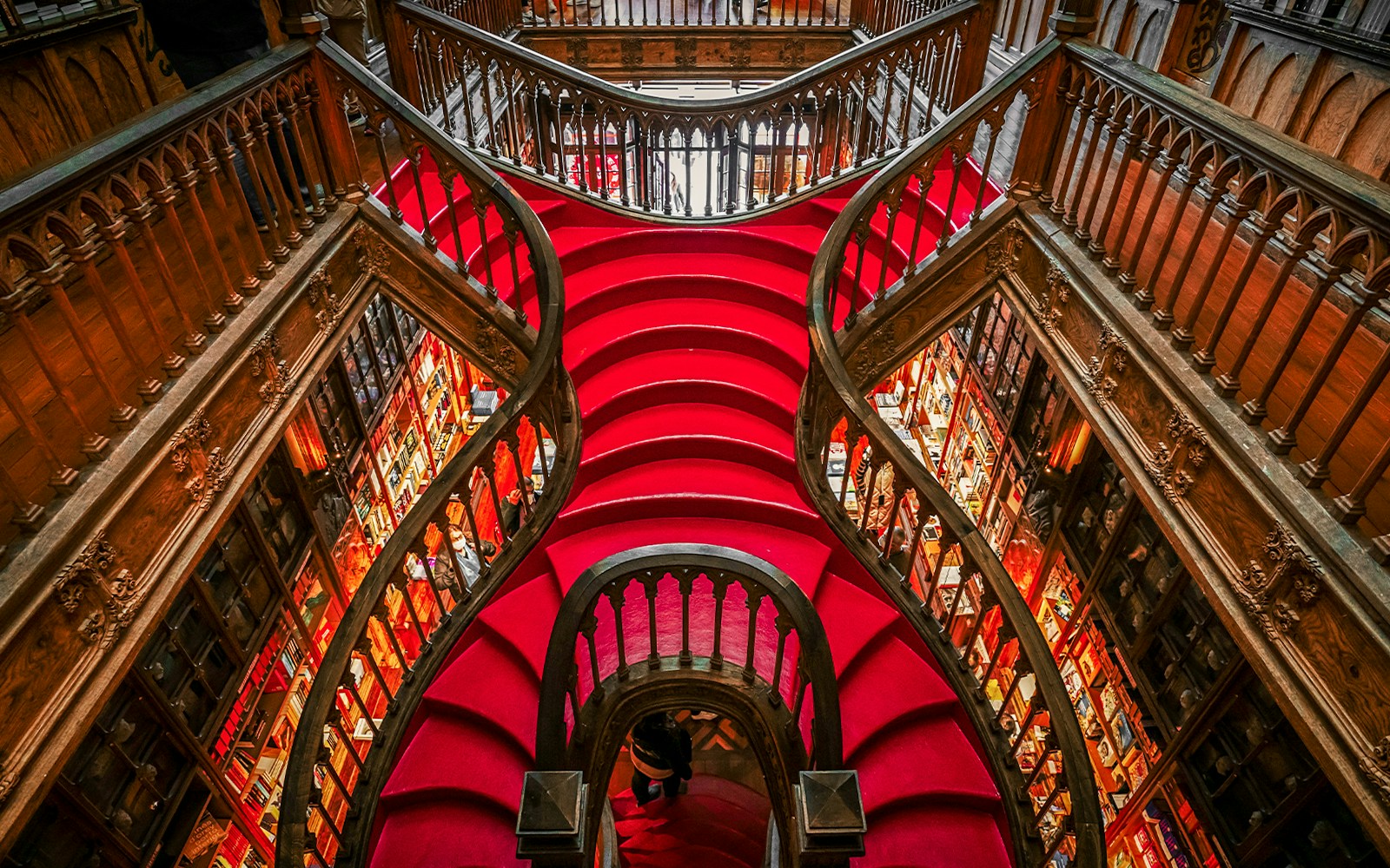 Lello Library's ornate staircase in Porto, Portugal, showcasing intricate design elements.
