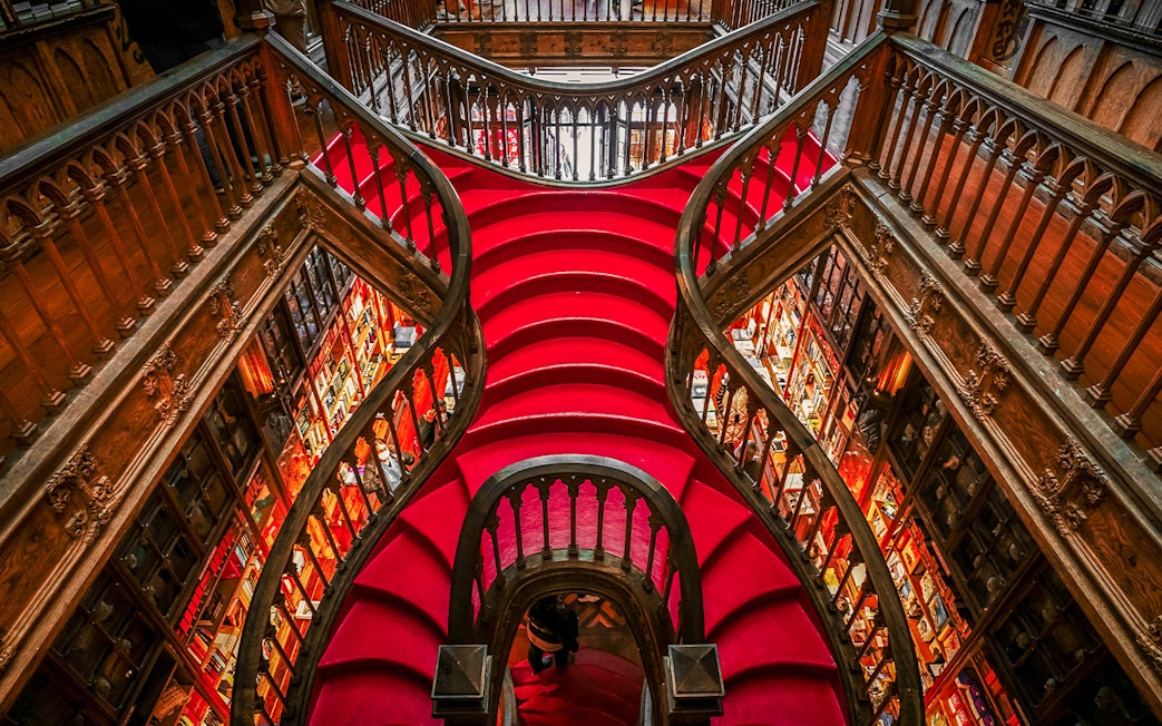 Lello Library's ornate red staircase design in Porto, Portugal.
