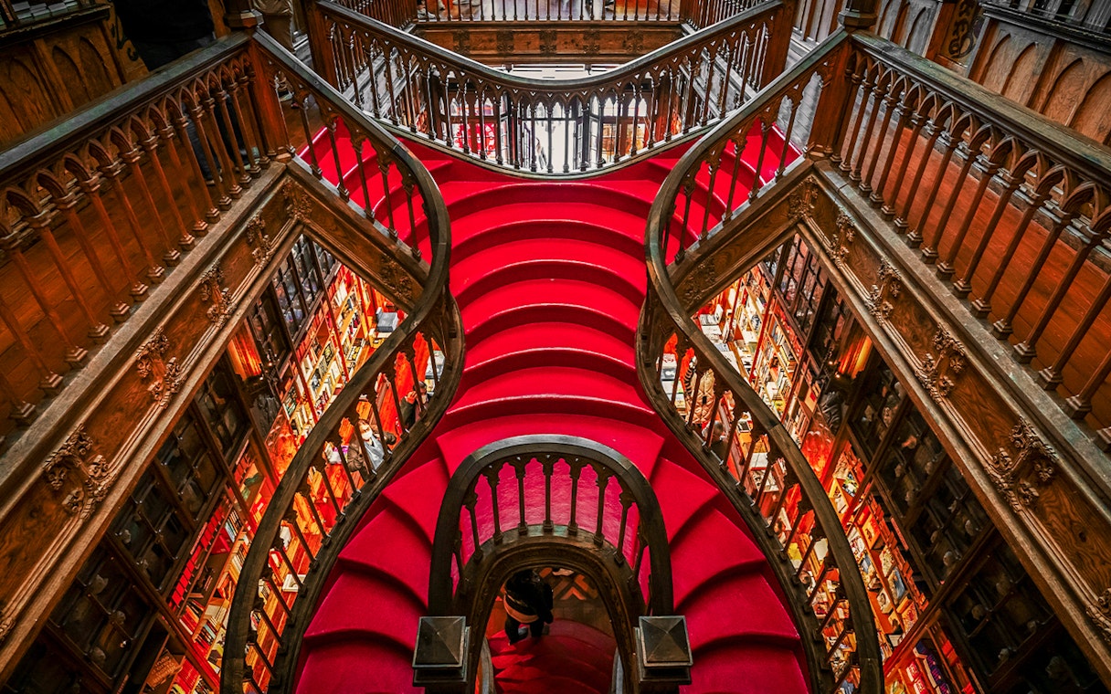 Lello Library's ornate red staircase design in Porto, Portugal.