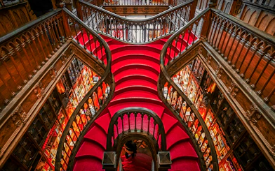 Lello Library's ornate red staircase design in Porto, Portugal.