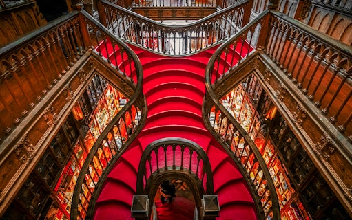 Lello Library's ornate red staircase design in Porto, Portugal.