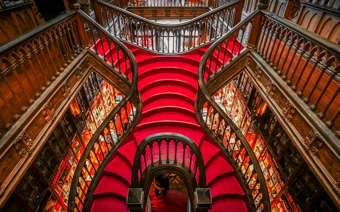 Lello Library's ornate red staircase design in Porto, Portugal.