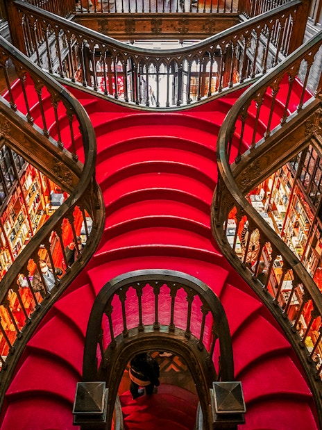 Lello Library's ornate red staircase design in Porto, Portugal.