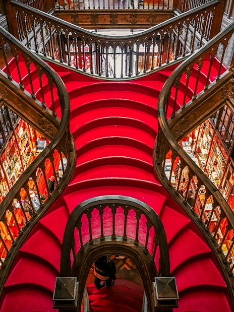 Lello Library's ornate red staircase design in Porto, Portugal.