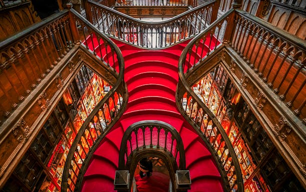 Lello Library's ornate red staircase design in Porto, Portugal.