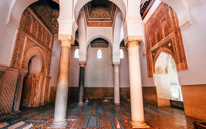 Saadian Tombs interior with ornate arches and columns in Marrakech, Morocco.
