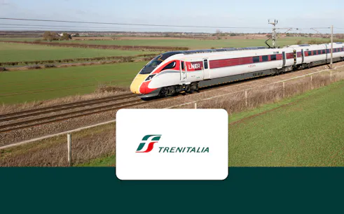 High-speed LNER train traveling through European countryside.