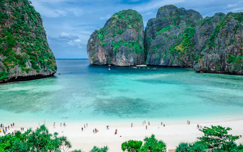 Phi Phi Islands beach with turquoise water and limestone cliffs, Krabi day trip.
