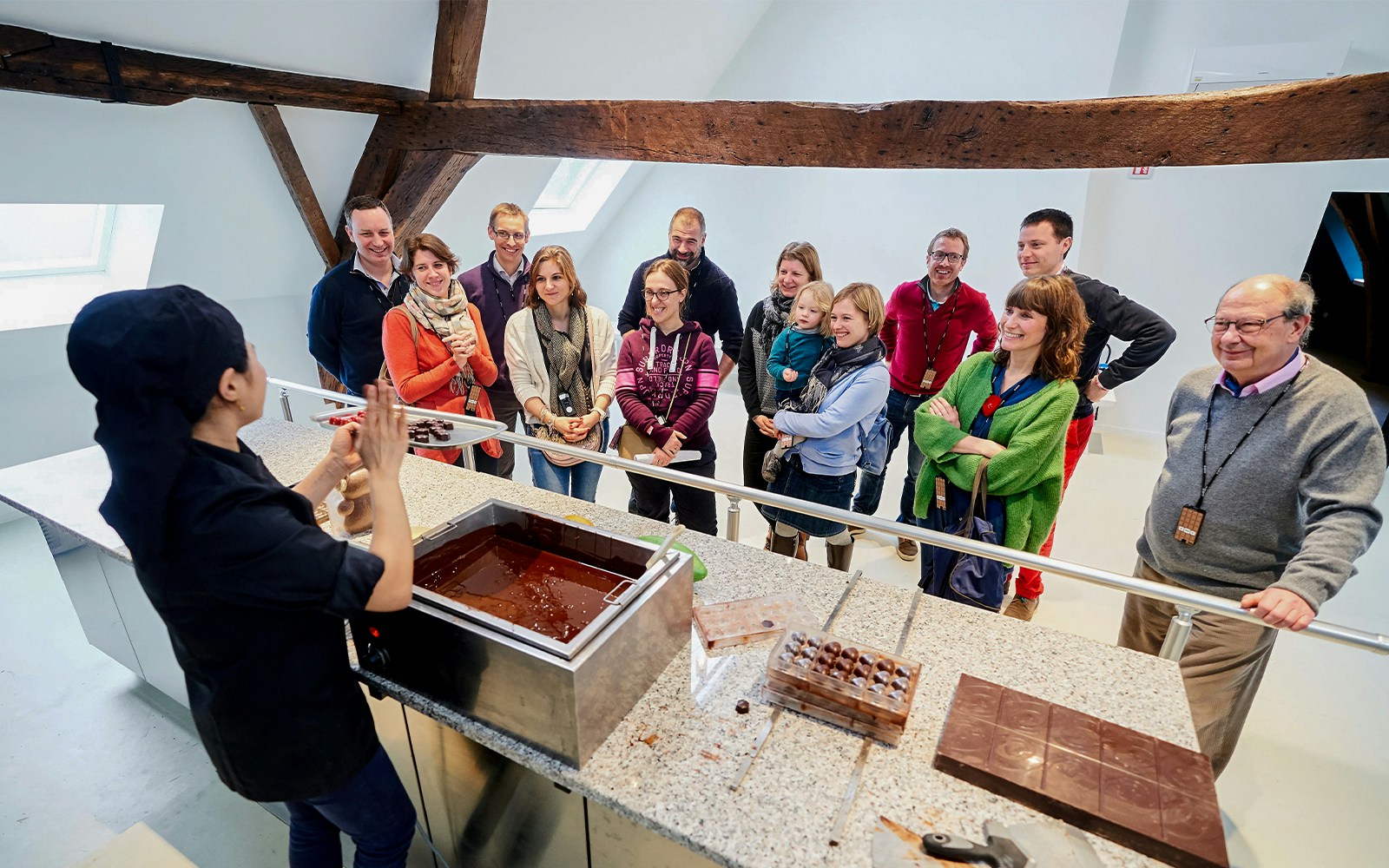 Visitors watching a chocolate-making demonstration at Choco Story Brussels.