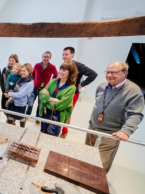 Visitors watching a chocolate-making demonstration at Choco Story Brussels.