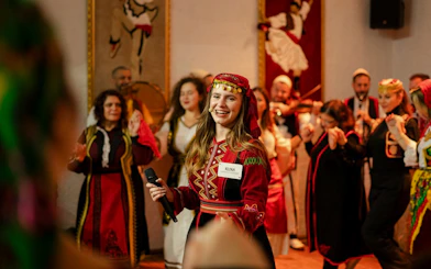 Artists performing traditional dance during Albanian Night Cultural Dance & Music Experience.
