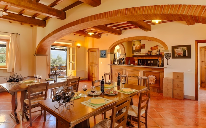 Chianti winery tasting room with tables set for wine sampling.