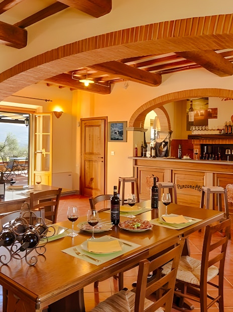 Chianti winery tasting room with tables set for wine sampling.