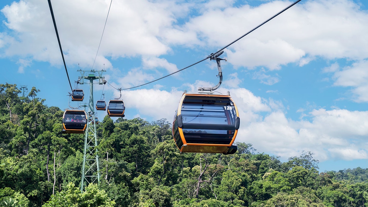 Cable car ascending to Ba Na Hills in Da Nang, Vietnam, with lush green mountains in the background.