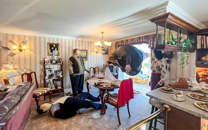 Dursley living room scene with floating Aunt Marge at Harry Potter London tour exhibit.