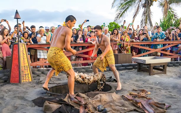 Polynesian performers preparing for cultural show at Germaine's Luau, Oahu, Hawaii.