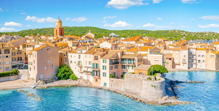 Saint-Tropez waterfront with historic buildings and bell tower, Provence, Cote d'Azur.