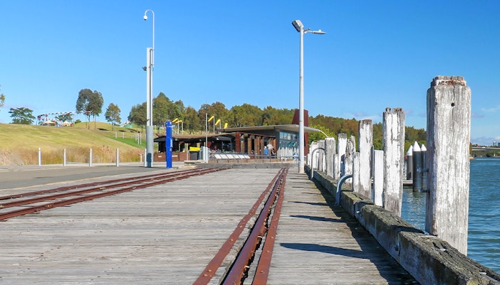 Newington Armoury rail line with historic tracks and surrounding greenery in Sydney, Australia.