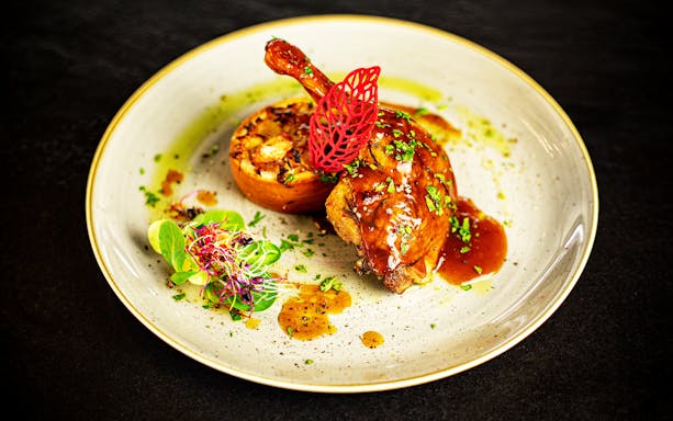 Gourmet dish served on Danube River dinner cruise with live piano show.