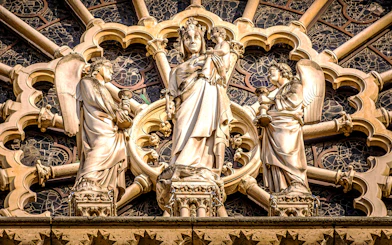 Notre-Dame Cathedral facade statues in Paris, featuring religious figures.