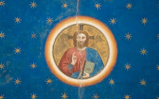 Giotto's fresco of Christ in Scrovegni Chapel, Padua, surrounded by stars.