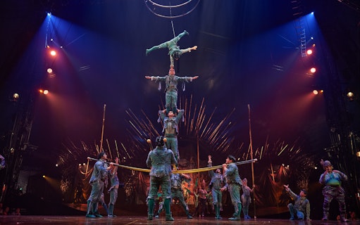 Acrobats performing a human pyramid at Cirque du Soleil: Alegría in Seville.