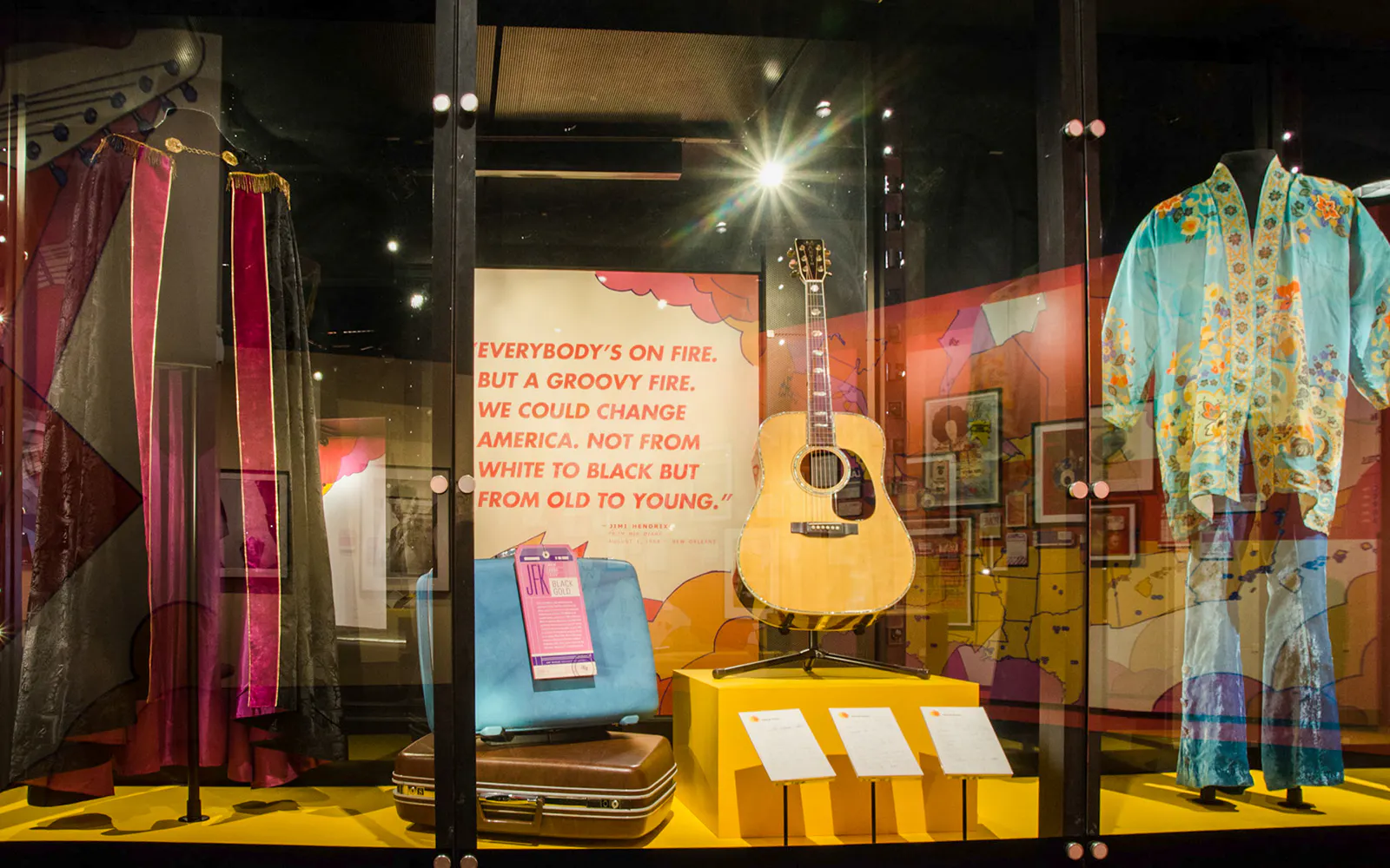 Guitar and colorful clothing display at Seattle's Museum of Pop Culture, part of Seattle CityPASS®.