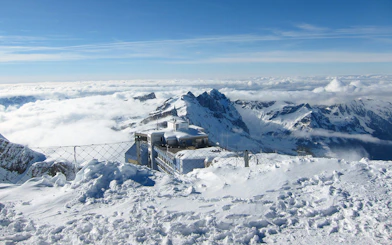 Snow-covered Mount Titlis summit with panoramic views of the Swiss Alps on a guided tour from Lucerne.