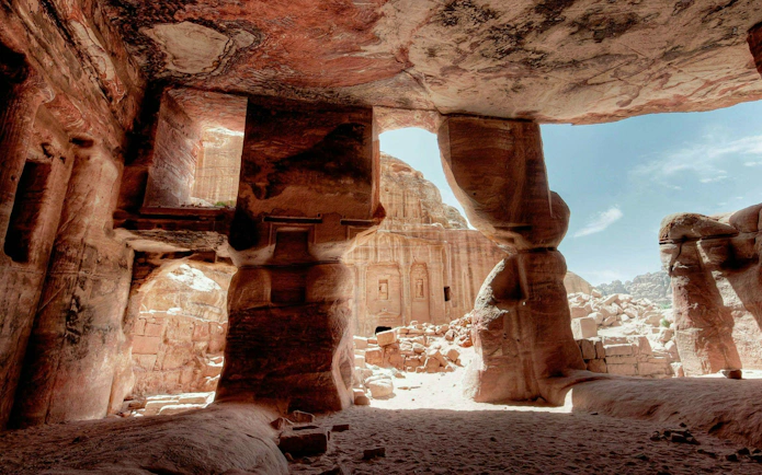 Petra's rock-cut architecture viewed from inside a cave, Jordan.