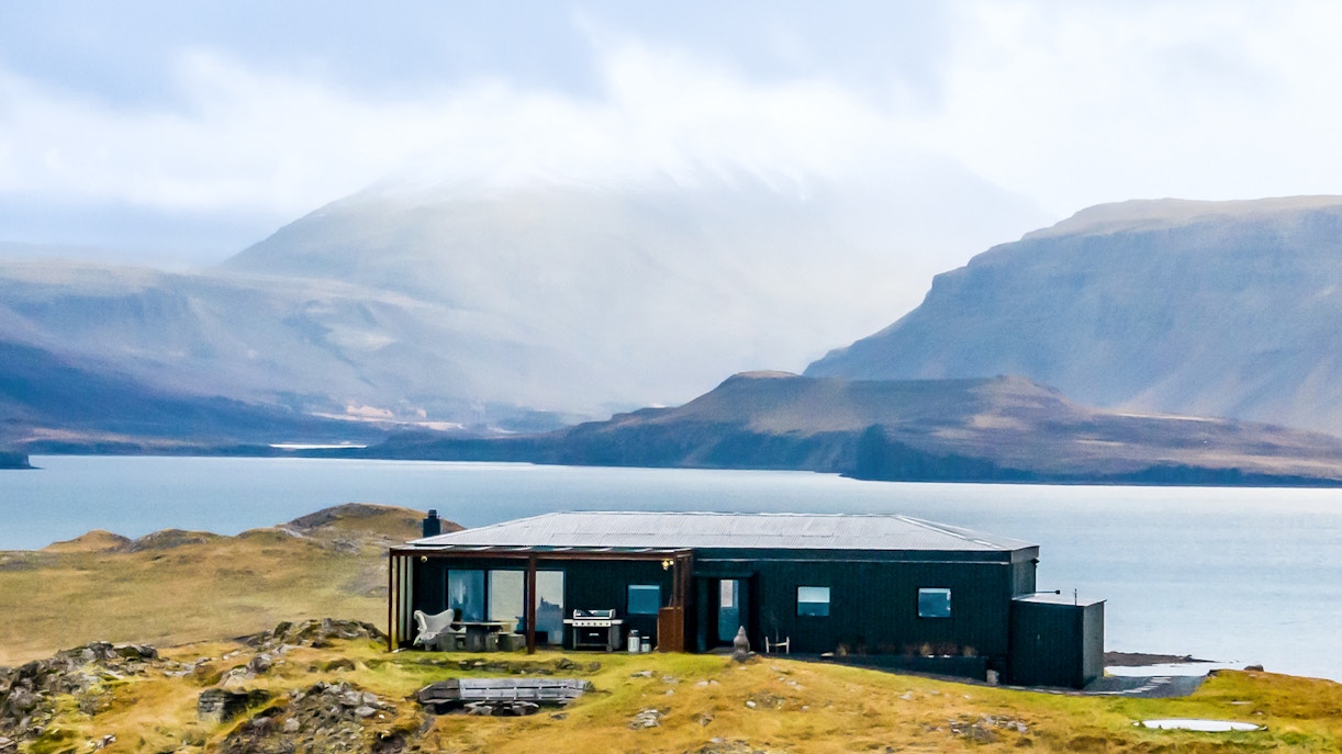 Aerial view of Hvalfjörður, Hvammsvik with distinctive black houses in Iceland.