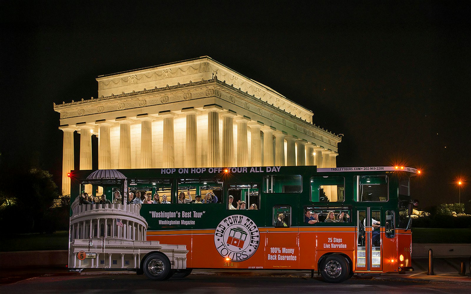Tour bus in front of illuminated Lincoln Memorial at night, Washington, DC.