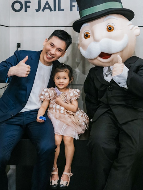 Man and child with Monopoly mascot at Monopoly Dreams Melbourne.