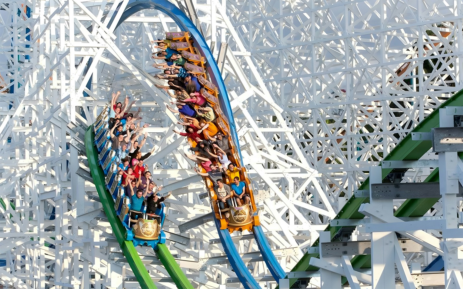 Roller coaster with riders at Six Flags Magic Mountain, California.