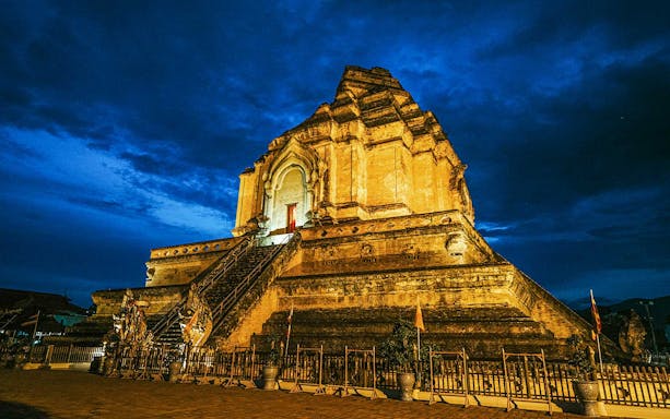 Wat Chedi Luang illuminated at night, Chiang Mai Night Bike Tour.